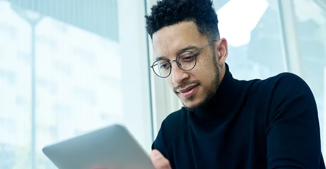 Image of man looking at computer