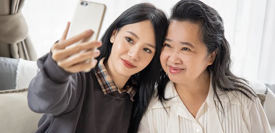 mom and daughter taking selfie photo