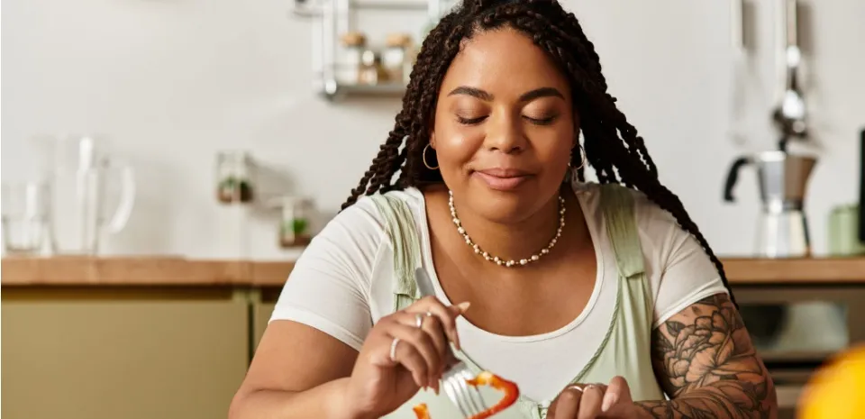 Women at a table eating mindfully enjoying each bite of food