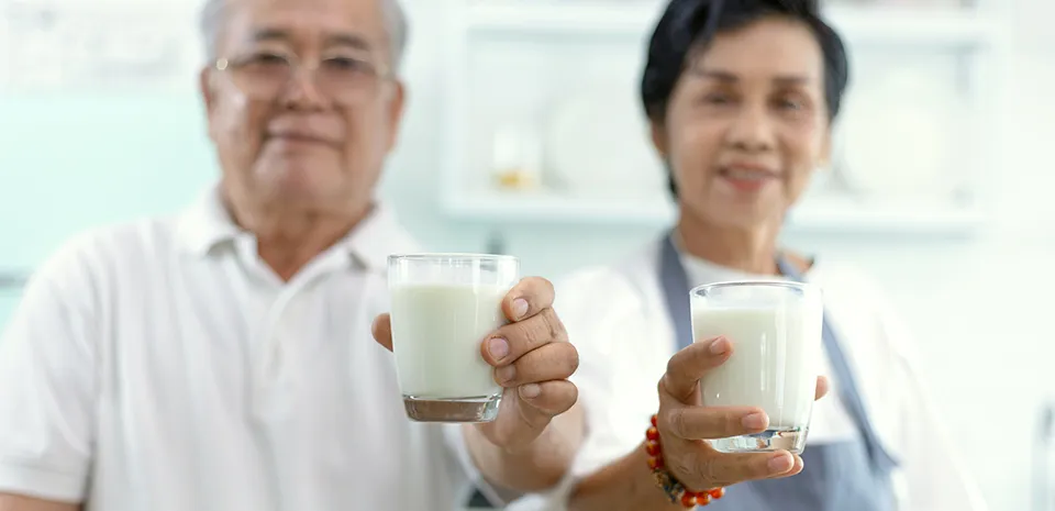asian elderly couple drinking milk