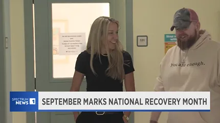 BSAS commissioner, Dee Calvert, tours Community Healthlink's recovery facility with a client.