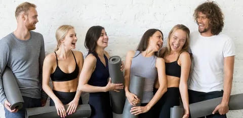 young adults after work out class at the gym