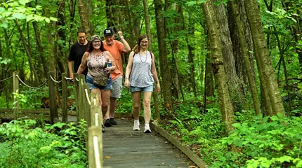 Hikers walk the trails at the Massachusetts Audubon Society's Broad Meadow Brook Wildlife Sanctuary in Worcester