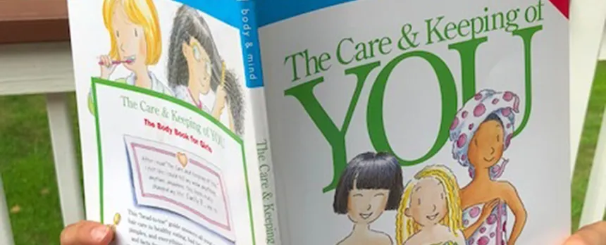 teen reading a book about puberty