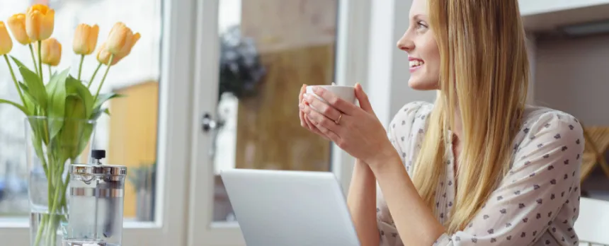 woman with mug enjoying micro practice of mindfulness before an online meeting